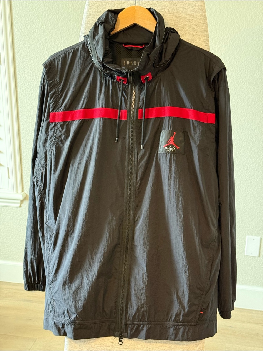 Jordan Men’s Black Windbreaker Jacket with Red Accents